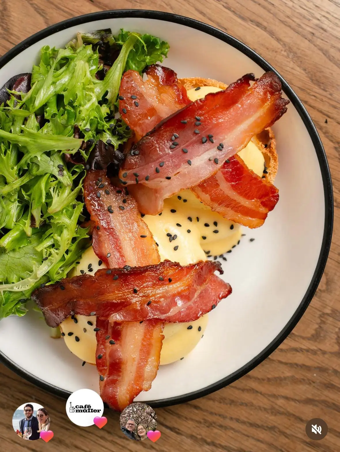 Eggs benedict with bacon and black sesame