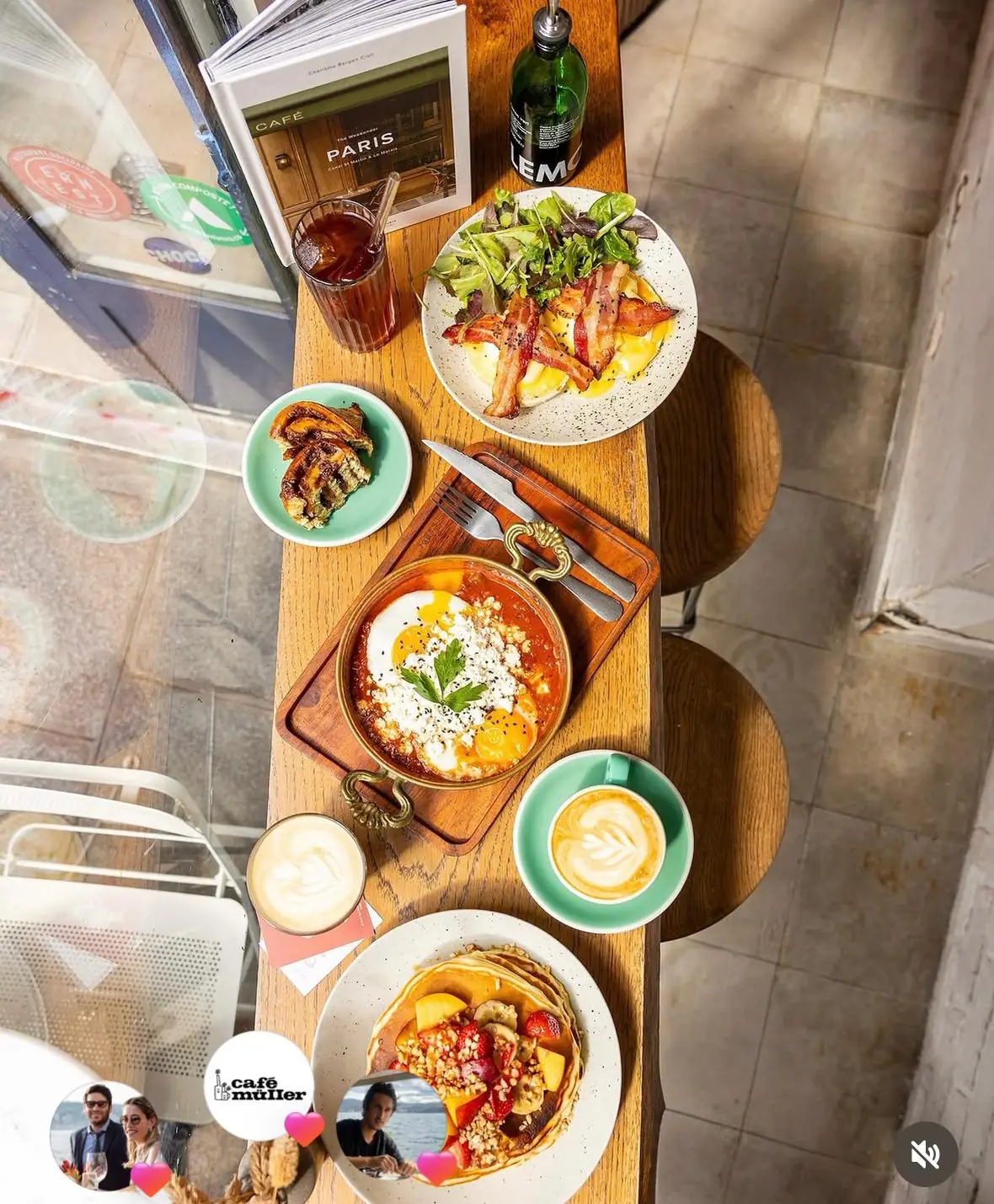 Shakshuka, eggs benedict, pancakes and lattes on a table